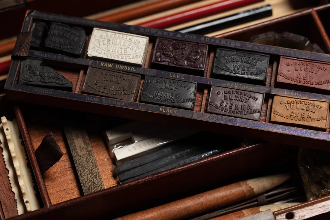 An artist's box of paints and brushes